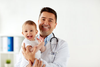doctor holding a baby